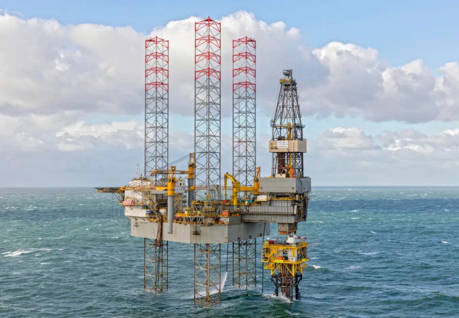 A Borr Drilling jack-up rig standing in open water under a blue sky